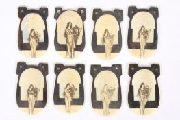 A collection of Art Nouveau ivory pendants with central figure of a lady playing a lyre of pierced