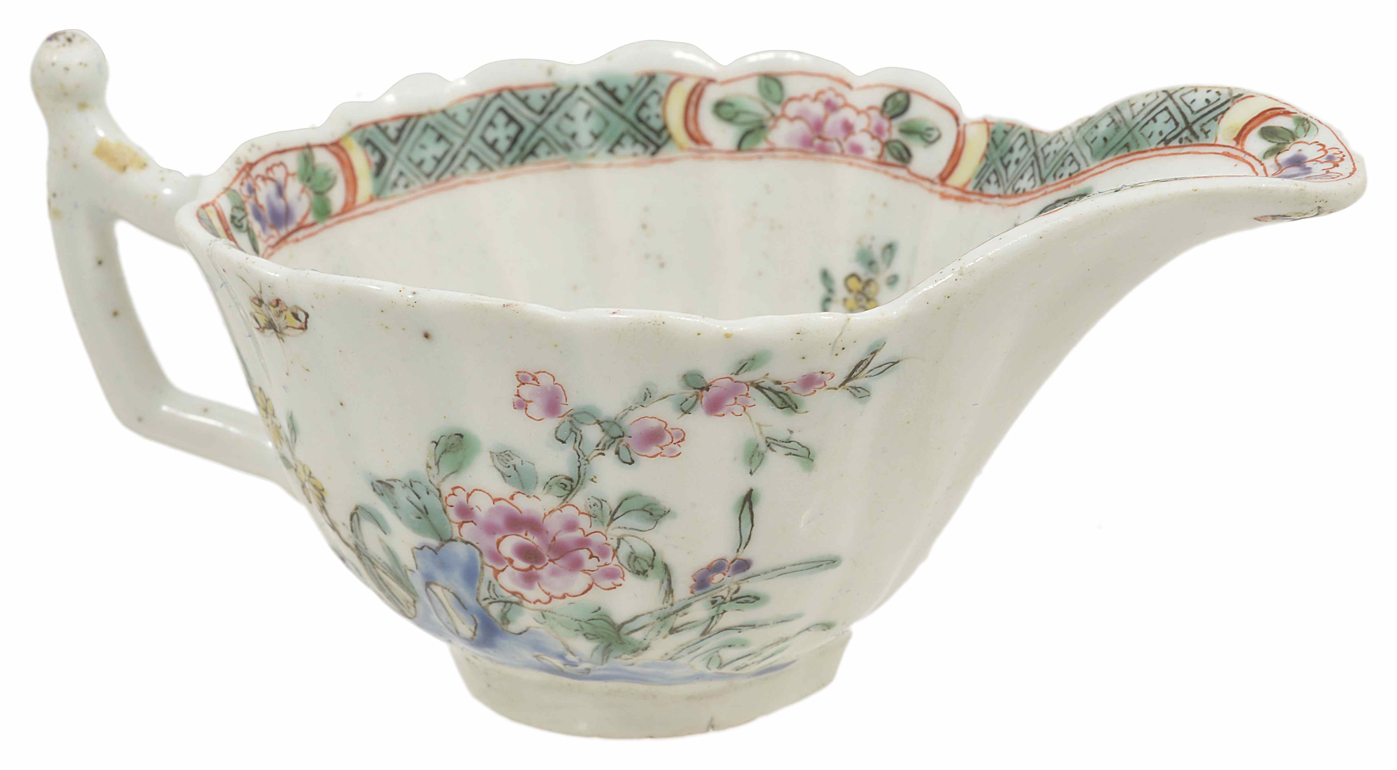 An early Worcester porcelain cream boat, circa 1753 with scalloped edge, the interior has hatched