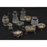 A collection of assorted silver and cut glass cruets comprising pepper grinder with turned wooden