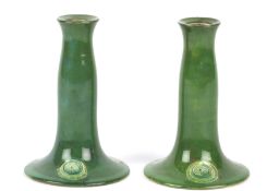 A pair of William Moorcroft Made for Liberty florian ware candlesticks, early 20th century the