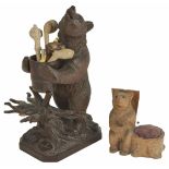 A Black Forest bear pipe rack, 20th century the standing bear holding a removable barrel, raised