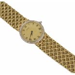 An 18ct gold and diamond ladies Piaget bracelet watch of slim construction, the circular dial within