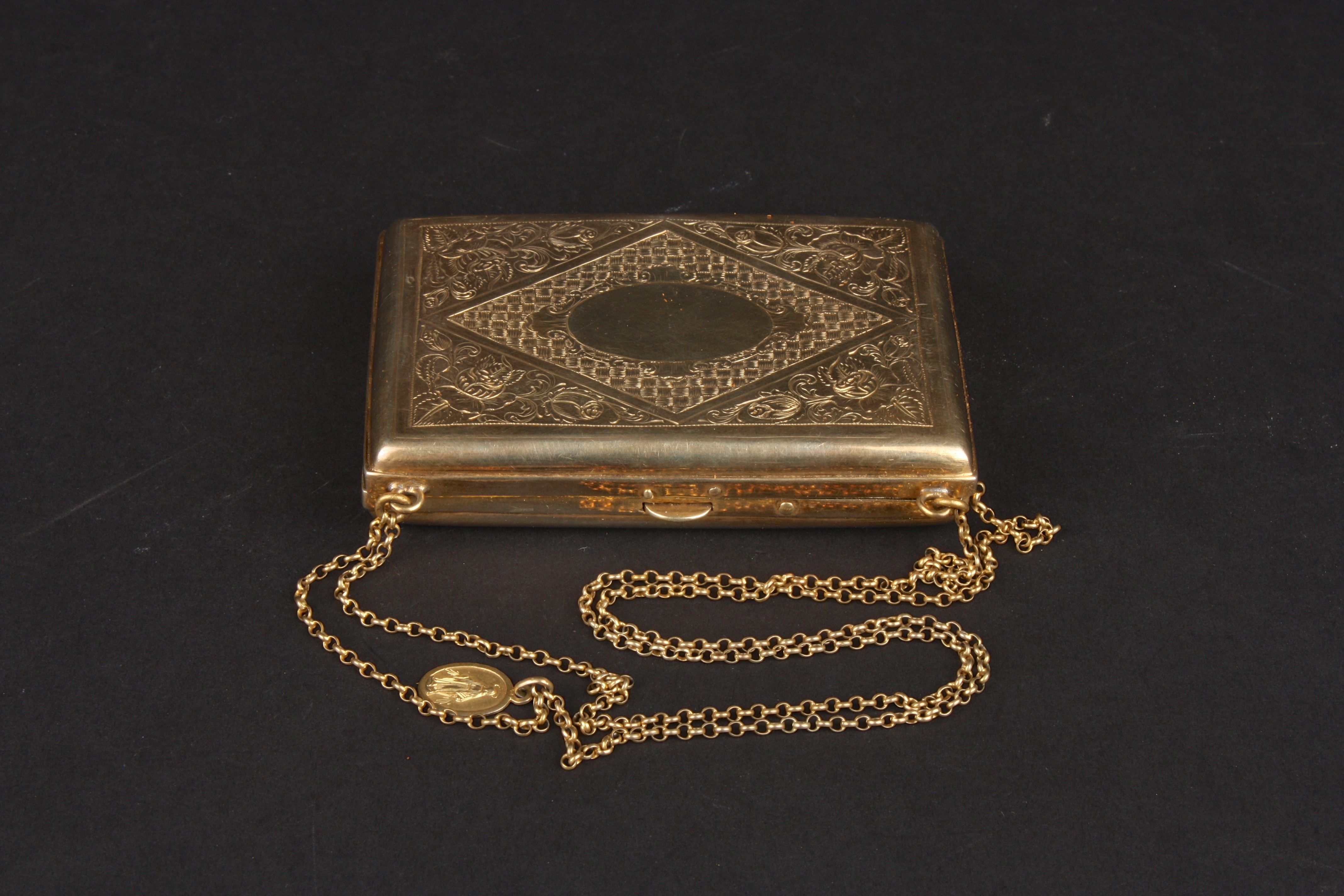 A Continental silver gilt metal evening purse of solid rectangular form with stylised floral