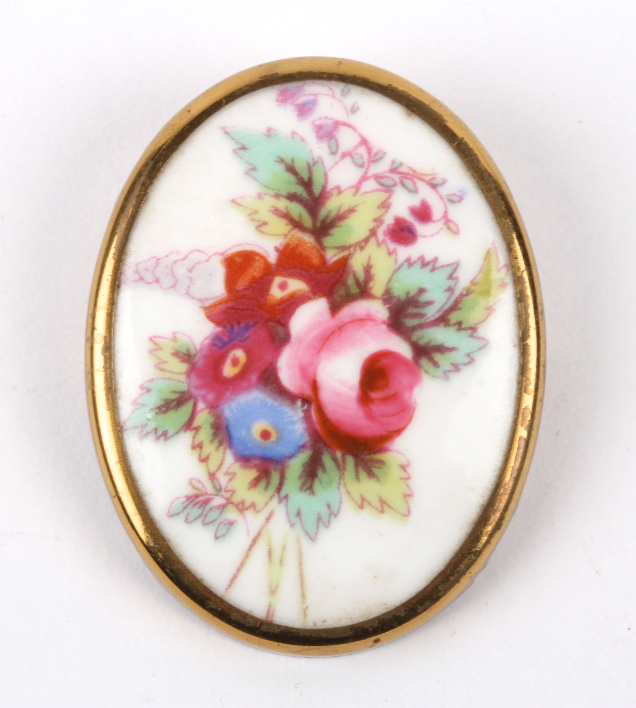 A vintage Royal Worcester porcelain brooch the oval brooch painted with a spray of summer blooms