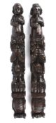 Two oak caryatids, late 18th/19th century of typical form with putti playing flutes above berry