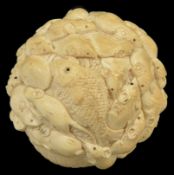 An early 20th century carved Japanese ivory 'rat ball' okimono well carved as rats clambering over a