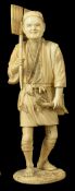 A Sectional Walrus Ivory Figurine, late 19th century depicting a man carrying a leafed branch,