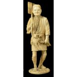 A Sectional Walrus Ivory Figurine, late 19th century depicting a man carrying a leafed branch,