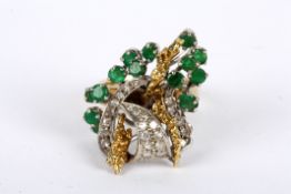 A large Continental emerald and diamond floral spray cocktail ring circa 1960 the high set mount