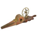 A mechanical brass and mahogany fire bellows, early 20th century of typical form with a shaped