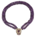 An unusual amethyst bead necklace the two rows of facetted amethyst beads with central amethyst