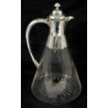 An Edwardian silver mounted glass claret jug, Birmingham 1904 the hinged lid with knopped finial,