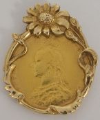 A Victorian fine gold sovereign in unusual gold floral mount the sovereign mounted in a 9ct gold