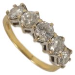 A striking five stone diamond set contemporary half hoop ring the diamonds of even size approx. 0.25