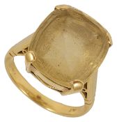 A large contemporary pale yellow topaz set dress ring the round cornered rectangular stone in a high