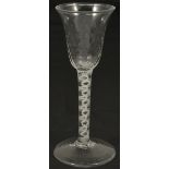 Three 18th century Cordial glasses the first example with trumpet bowl of dimpled glass above an