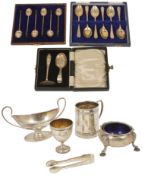 A collection of assorted silverware including a christening tankard hallmarked Birmingham 1921,