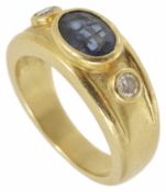 A large heavy 18ct gold mounted gentleman's sapphire and diamond set ring the central oval blue