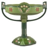 An Austrian Art Nouveau Eichwald pedestal table centre of oval form with two side handles upon a