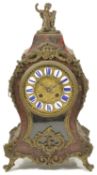 A French red stained Boulle mantle clock circa 1860 the twelve piece enamel cartouche dial, bell