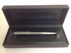 An Alfred Dunhill ballpoint pen, silvered body, in original brown box length: 14.2 cmCondition: