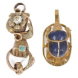 A Victorian two colour gold fancy 'hand clasping ring' clasp and a scarab pendant the clasp modelled