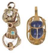 A Victorian two colour gold fancy 'hand clasping ring' clasp and a scarab pendant the clasp modelled