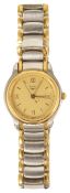 A Longines ladies wristwatch a gold coloured dial with Roman numeral hours and baton minutes, with