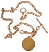 An Edwardian 9ct. gold watch Albert chain with sovereign fob the rose gold curb link chain with clip