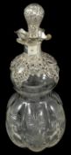 A Victorian silver mounted glass decanter, Birmingham 1899 the glass and silver flower head embossed