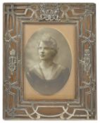 An Edwardian silver mounted oak photograph frame, London 1904 of rectangular form with oak frame