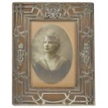 An Edwardian silver mounted oak photograph frame, London 1904 of rectangular form with oak frame