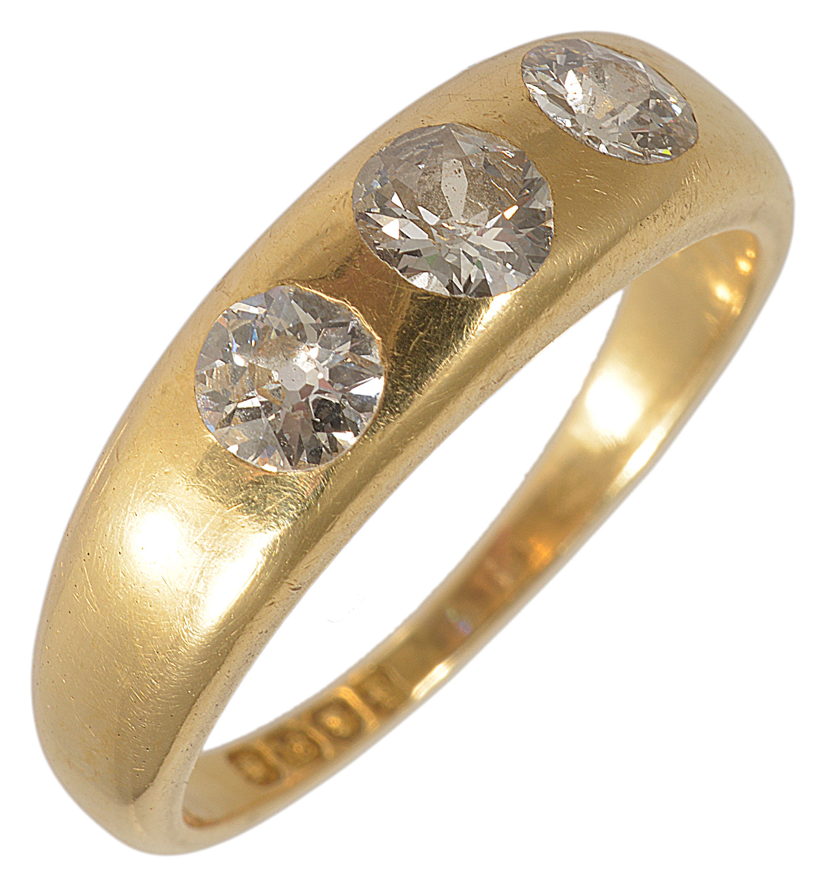 An good quality gentleman's three stone diamond set ring, circa 1900 the central diamond in a sunken