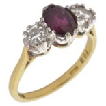 A ruby and diamond three stone ring with central oval ruby of pleasing colour approx. weight 1.00