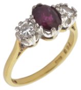 A ruby and diamond three stone ring with central oval ruby of pleasing colour approx. weight 1.00