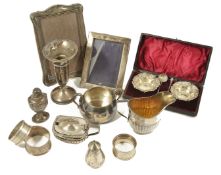 A collection of assorted silver including tableware comprising two photo frames, a pair of cased