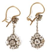 A pair of delicate Victorian diamond cluster drop earrings the circular 'daisy' diamond cluster with