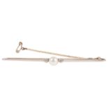 An elegant Edwardian pearl and diamond bar brooch set with a central 'button' pearl with single