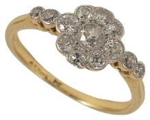 A delicate Edwardian diamond set fancy cluster ring the central circular diamond cluster within twin