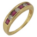 A contemporary diamond and ruby seven stone ring the stones set alternately in an 18ct gold