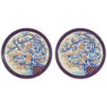 A pair of very large Japanese Imari circular chargers, circa 1900 the centre painted with a bird