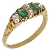 A Victorian emerald and diamond half hoop ring the centre set with twin diamonds, flanked by