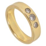 A simple heavy yellow metal band ring set with three small central diamonds the diamonds in a sunken