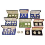 A collection of Franklin Mint and Royal Mint Coinage to include a cased set of 9 1976 Jamaica