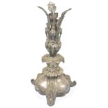 A Victorian silver plated epergne with three acanthus leaves above three rams heads upon a