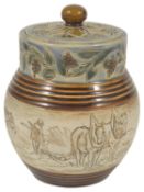 A Hannah Barlow Doulton Lambeth stoneware lidded Jar, dated 1887 decorated with an incised band of