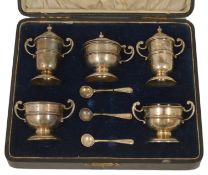 A five piece cased silver cruet set hallmarked Birmingham 1919, the pepperettes of miniature