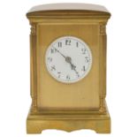 A French four glass brass carriage clock the bevelled glass flanked by turned faceted columns with
