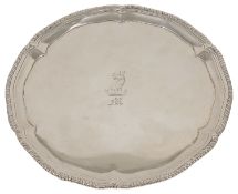 A George III silver salver, London 1774 with gadrooned and pie crust border, with family crest to