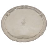 A George III silver salver, London 1774 with gadrooned and pie crust border, with family crest to